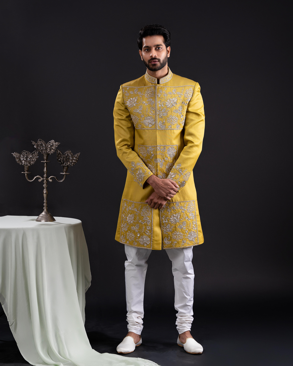 Full front view showing the elegant gold sherwani with white pants