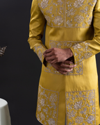 Close-up shot of gold thread embroidery on sherwani