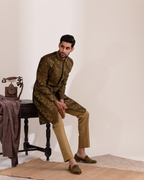 Frontal shot showing the earthy green sherwani and straight fit pants
