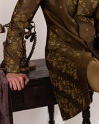 Closeup shot showing thread embroidery and foliage detail on mehndi sherwani
