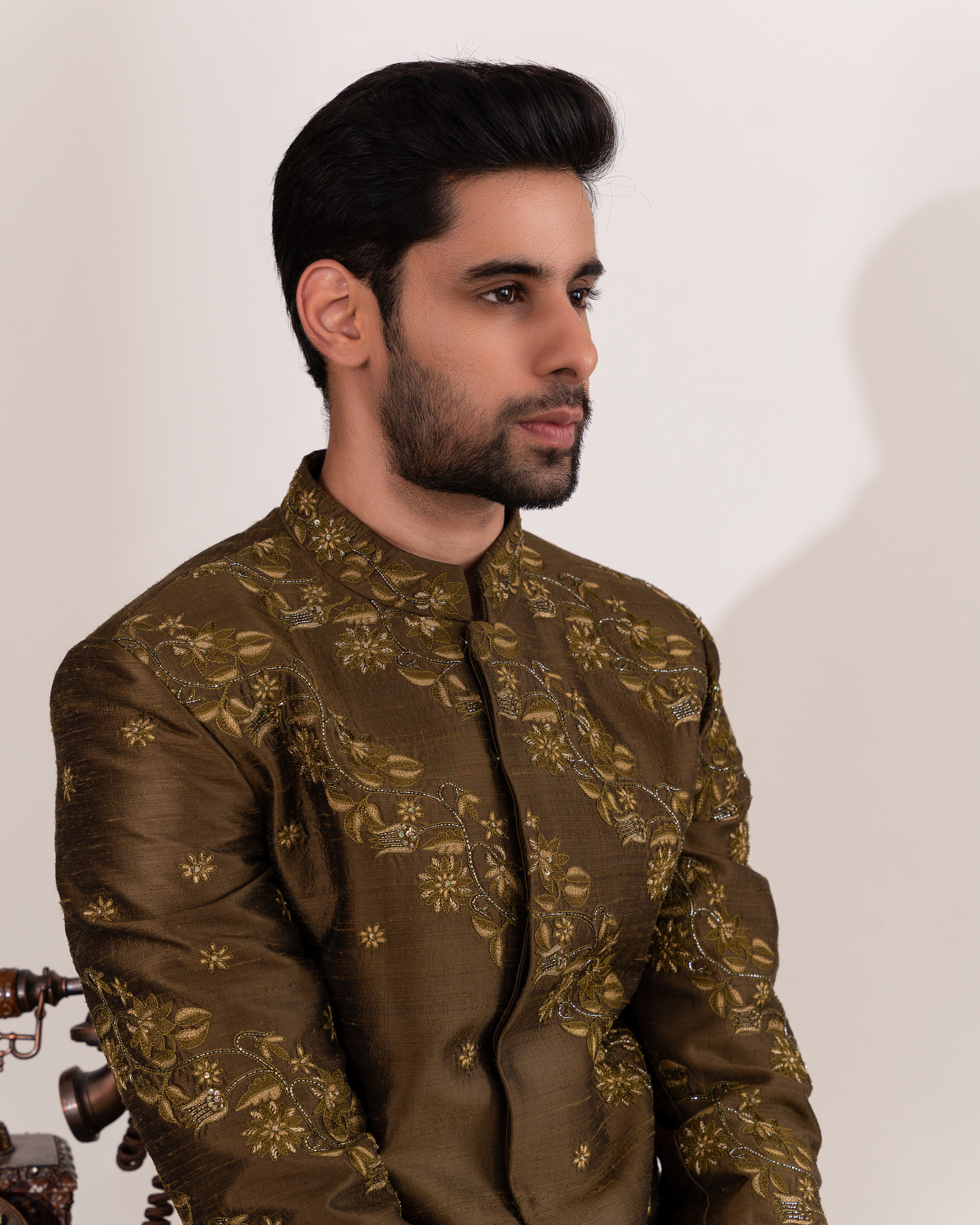 Close-up of botanical embroidery on the sherwani.