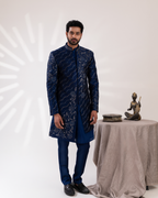 Full front view showing classic navy sherwani and straight pants