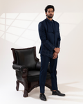 Front view of a navy bandhgala with sharp lapel detailing.