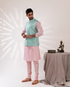 Full front shot showing the fresh aqua tone bundi jacket and kurta fit.