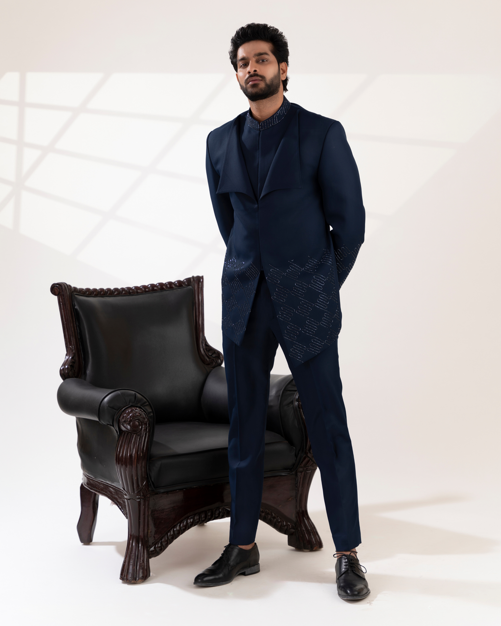 Full front view capturing the modern navy bandhgala silhouette with straight fit pants