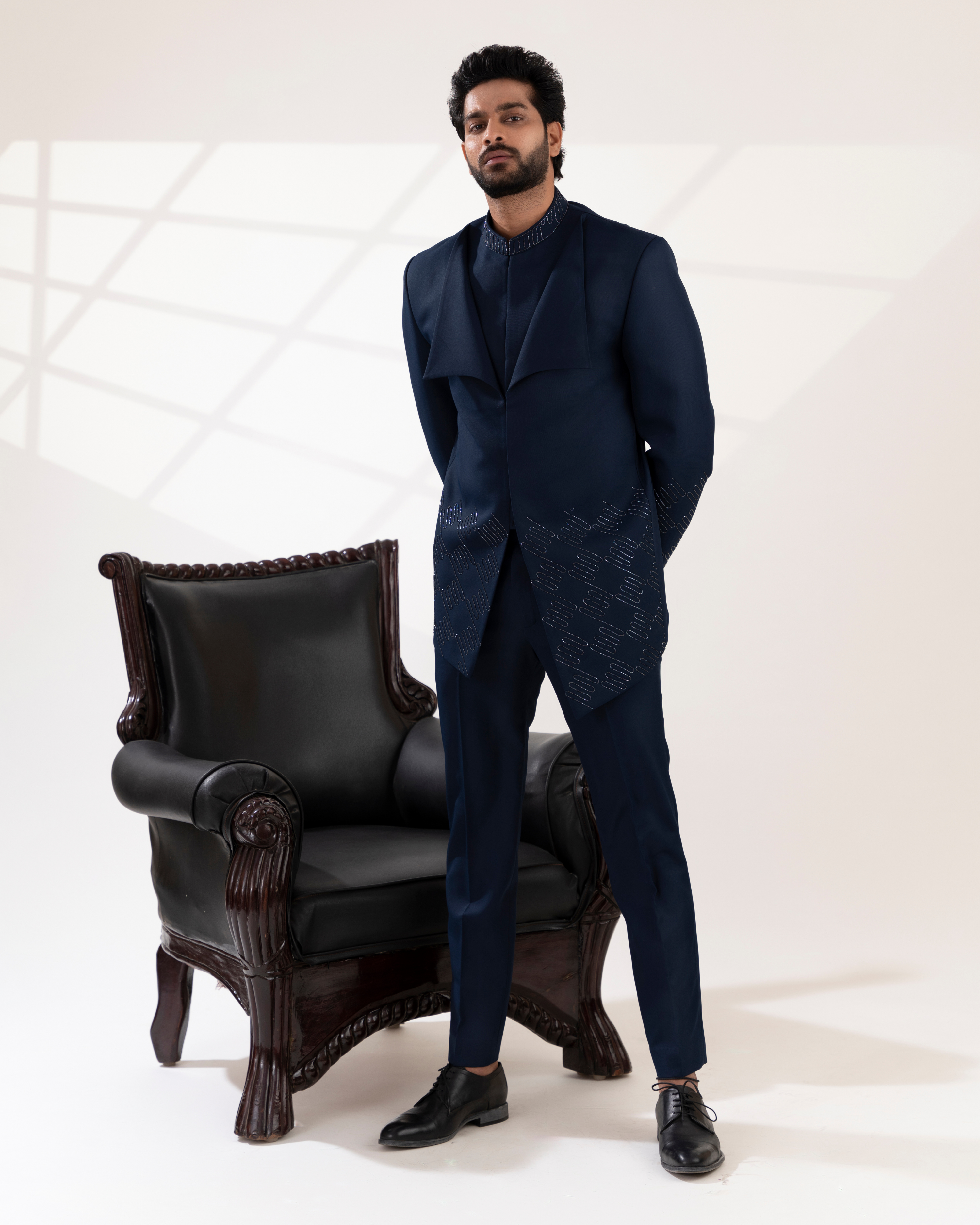 Full front view capturing the modern navy bandhgala silhouette with straight fit pants