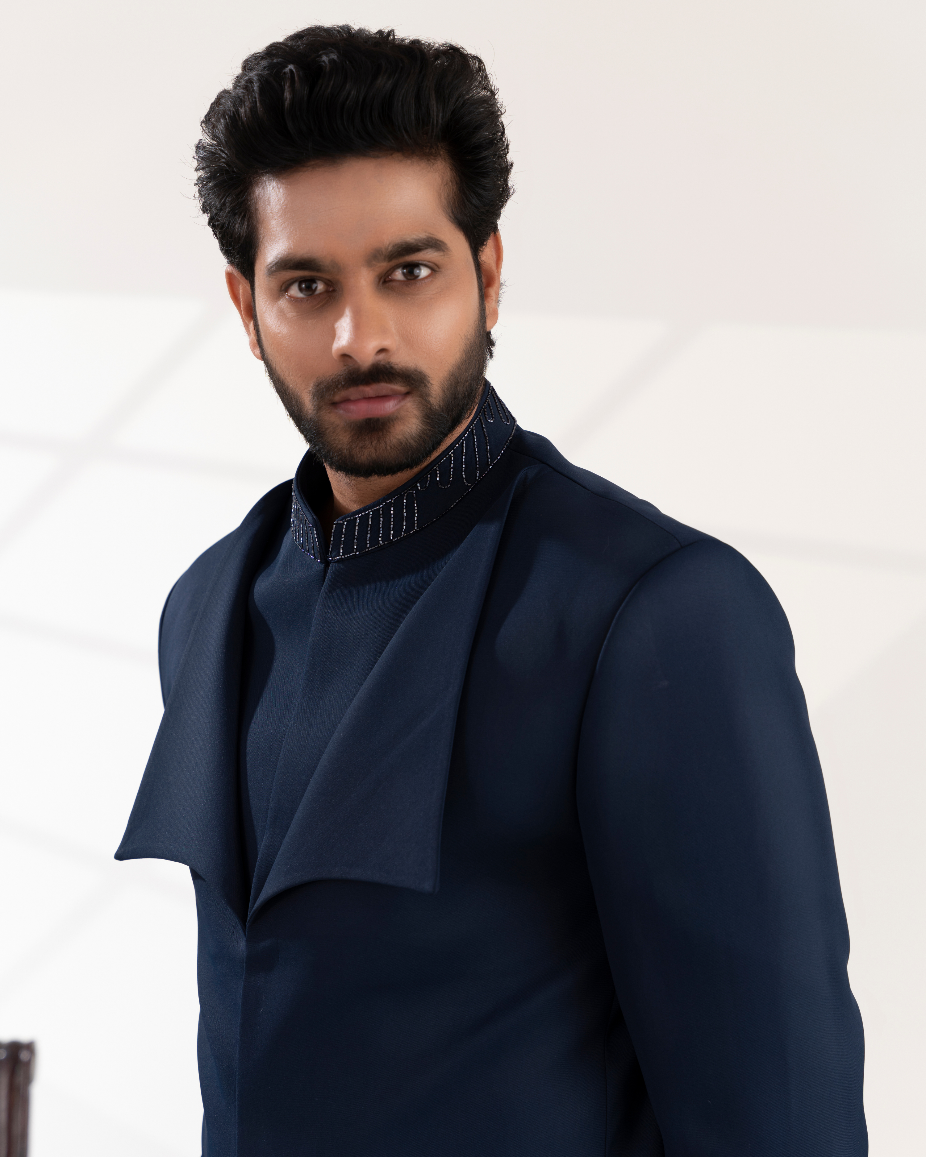 Close-up of lapel detailing and embroidery on navy blue bandhgala