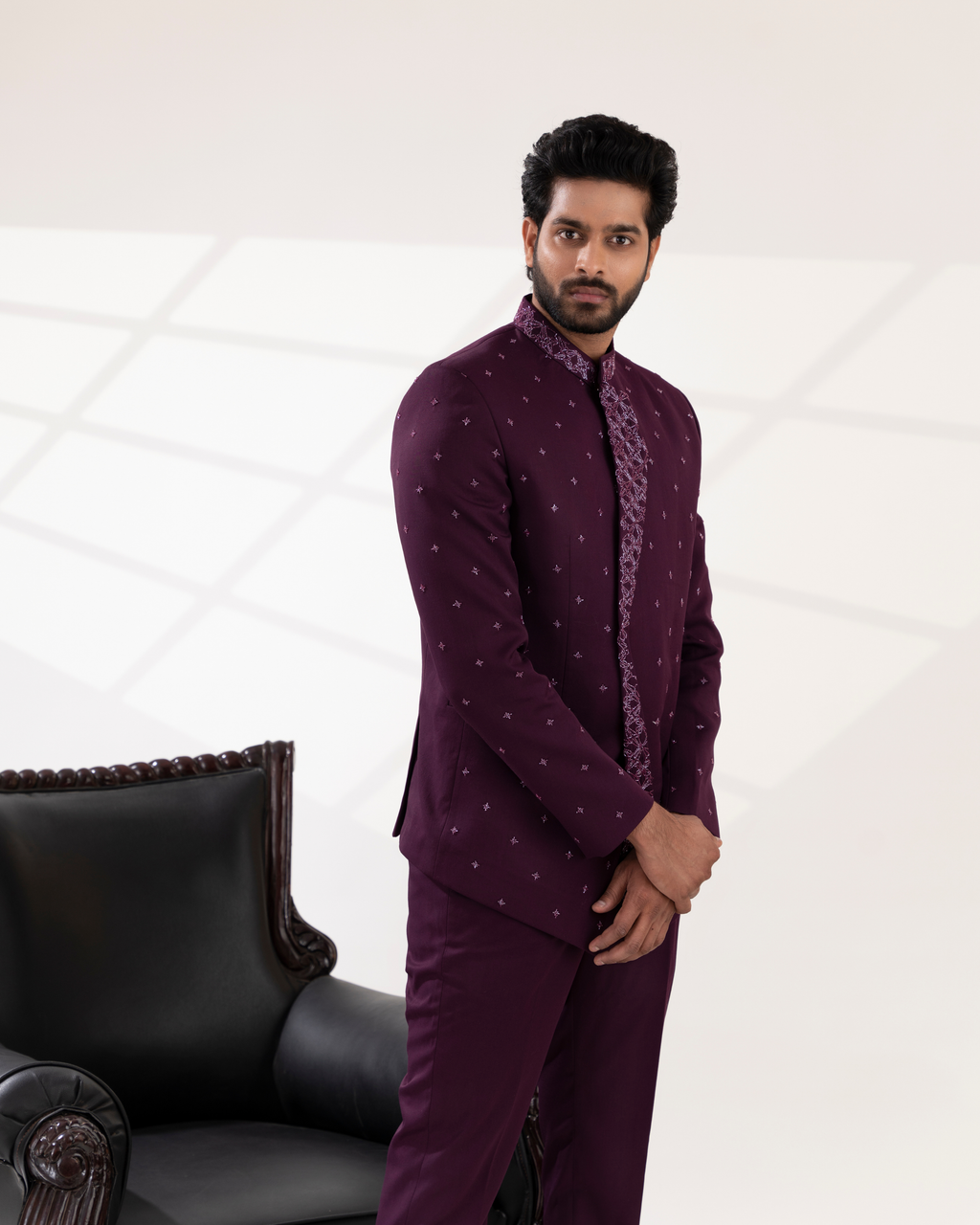 Man wearing a purple traditional outfit 