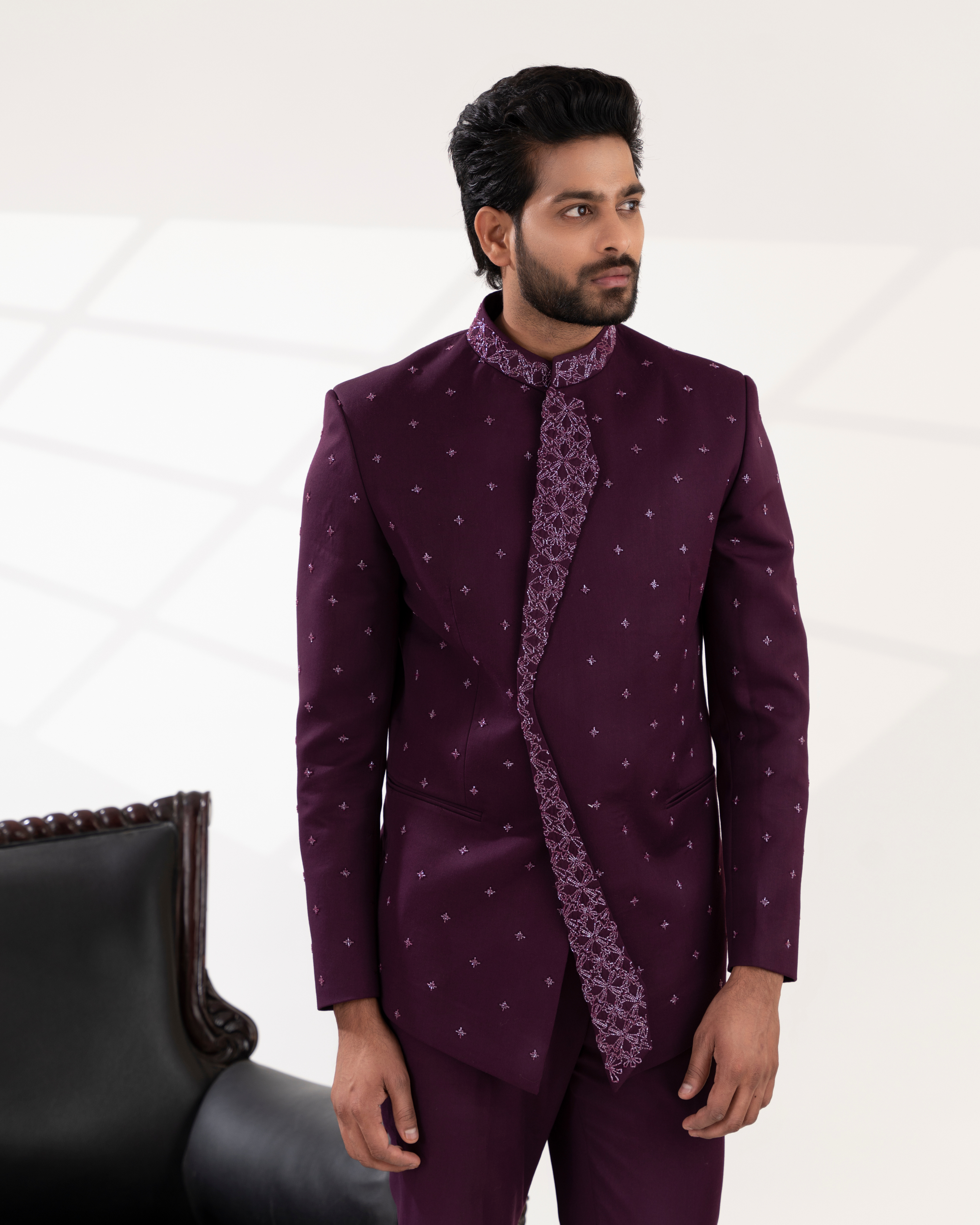 Frontal shot highlighting the rich wine bandhgala silhouette and embroidery