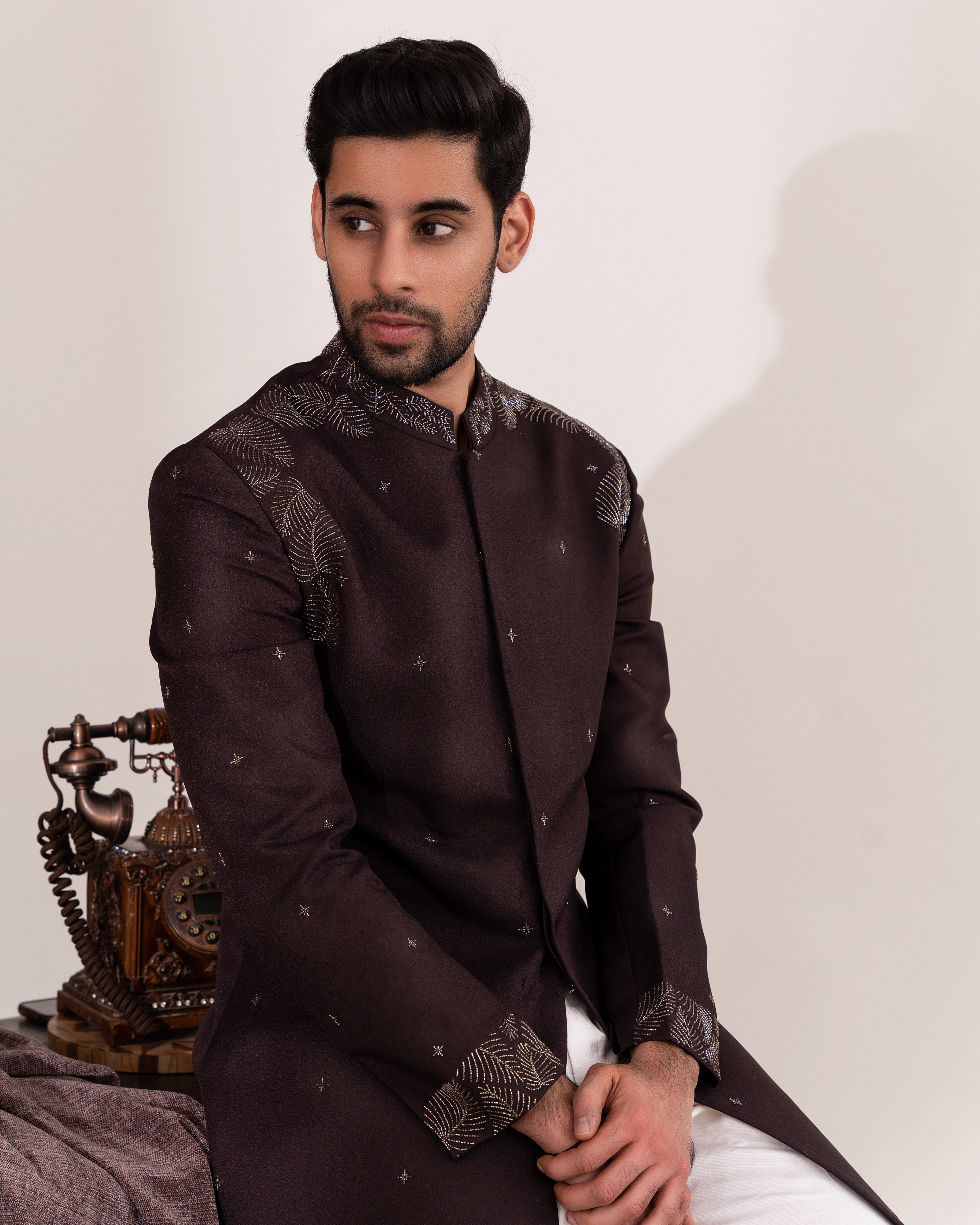 Frontal shot highlighting brown bandhgala and foliage embroidery