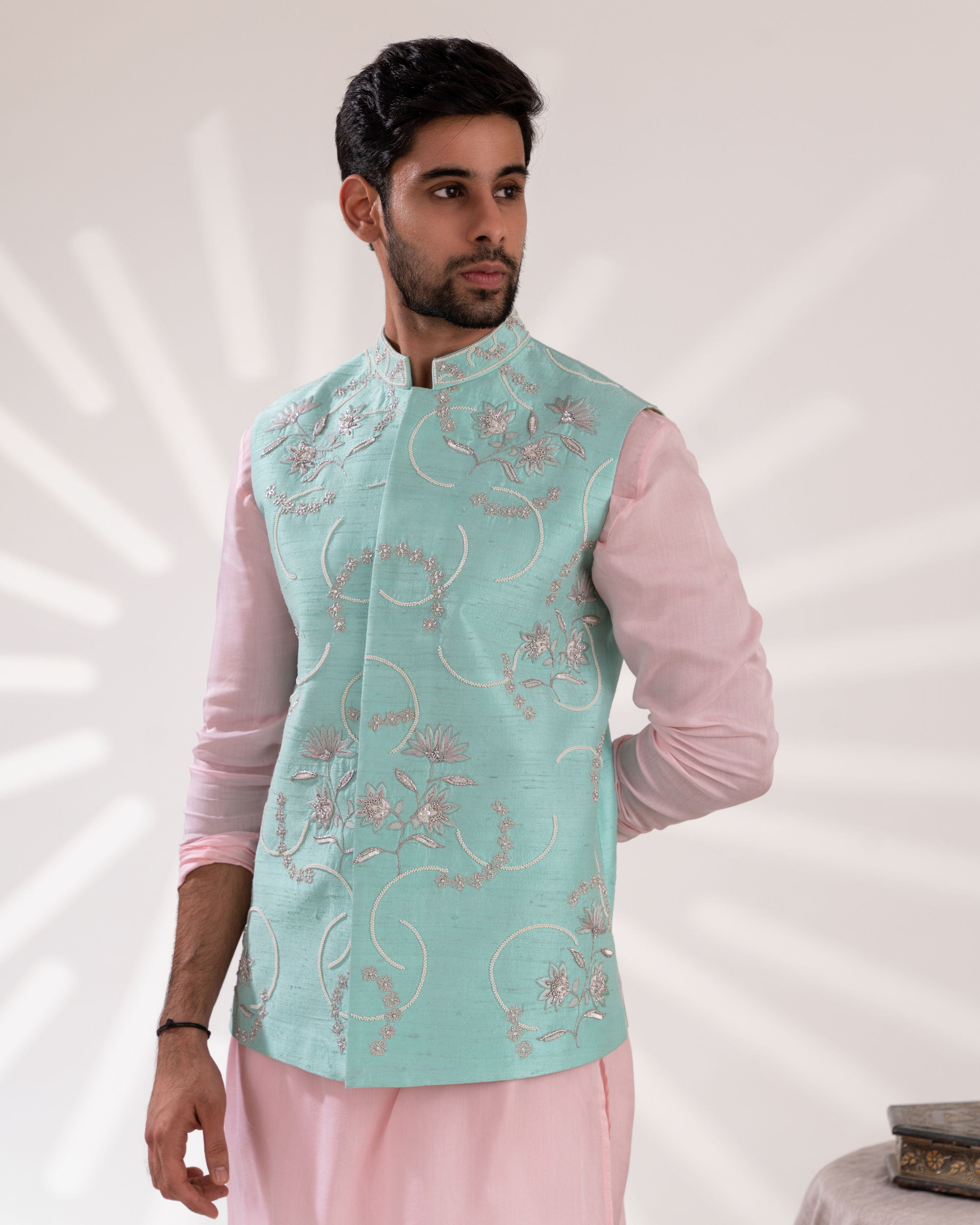 Detailed embroidery close-up showing threads and motifs on bundi jacket.
