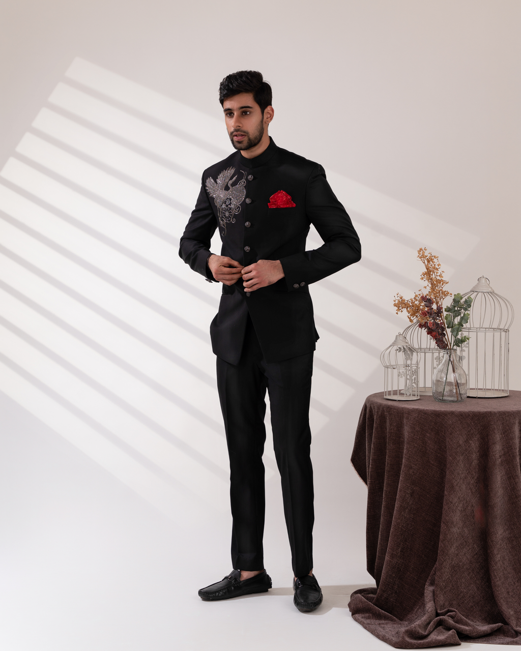 Full front view capturing structured bandhgala and straight fit pants