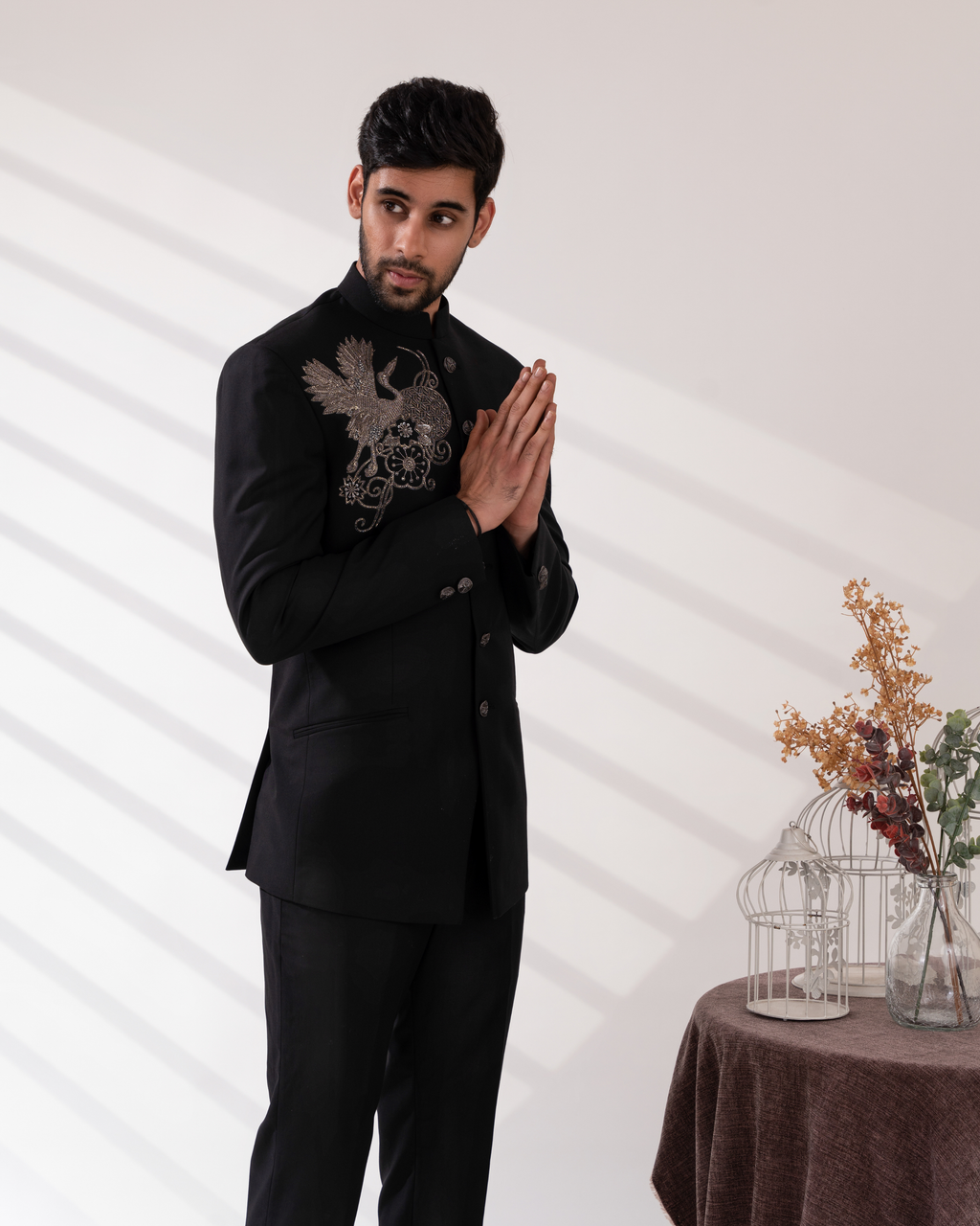 Side view showing bandhgala tailoring and gold bird embroidery