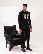 Side profile showing gold embroidery placement on bandhgala paired with straight pants