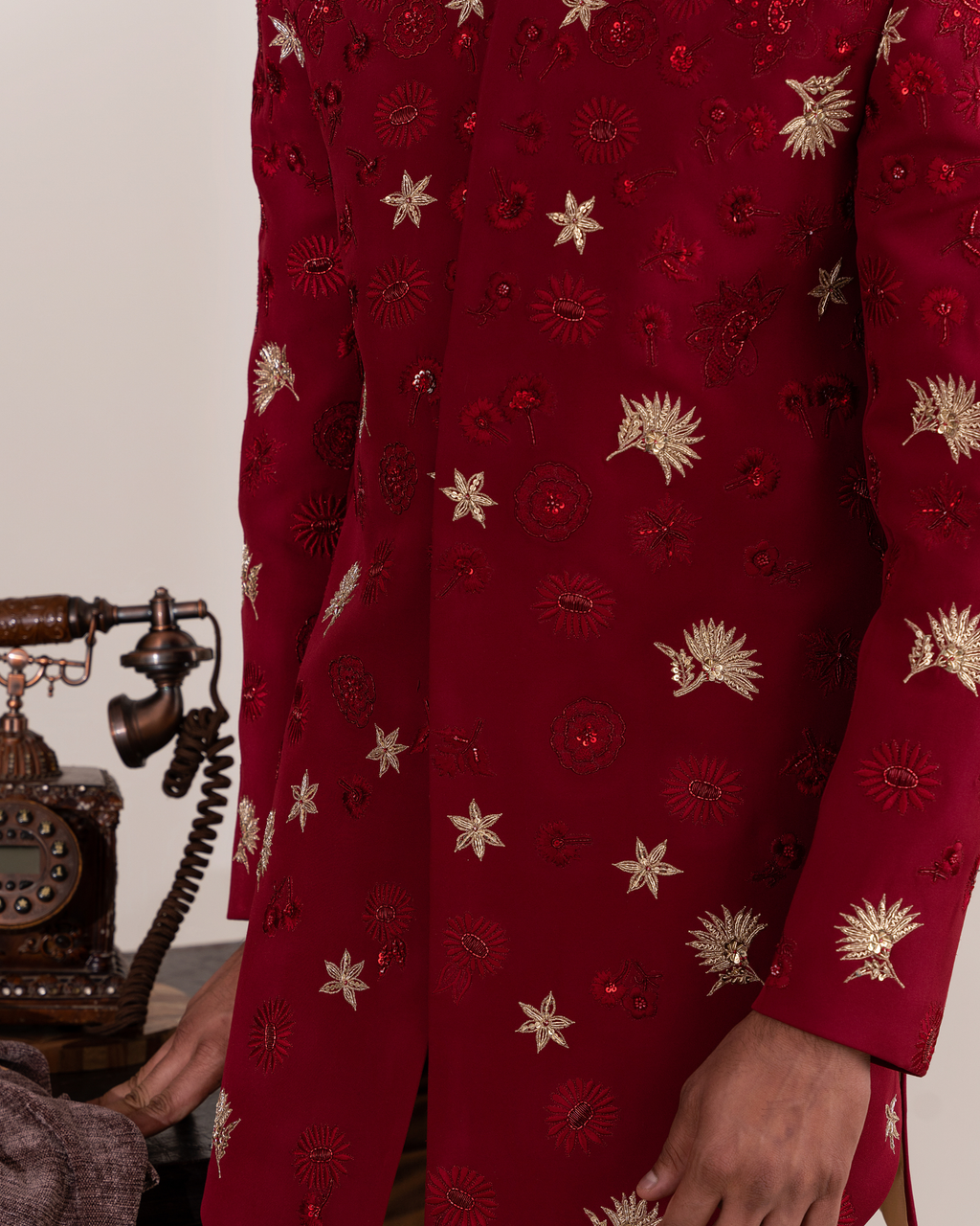 Macro shot showing thread embroidery and motif work red bandhgala