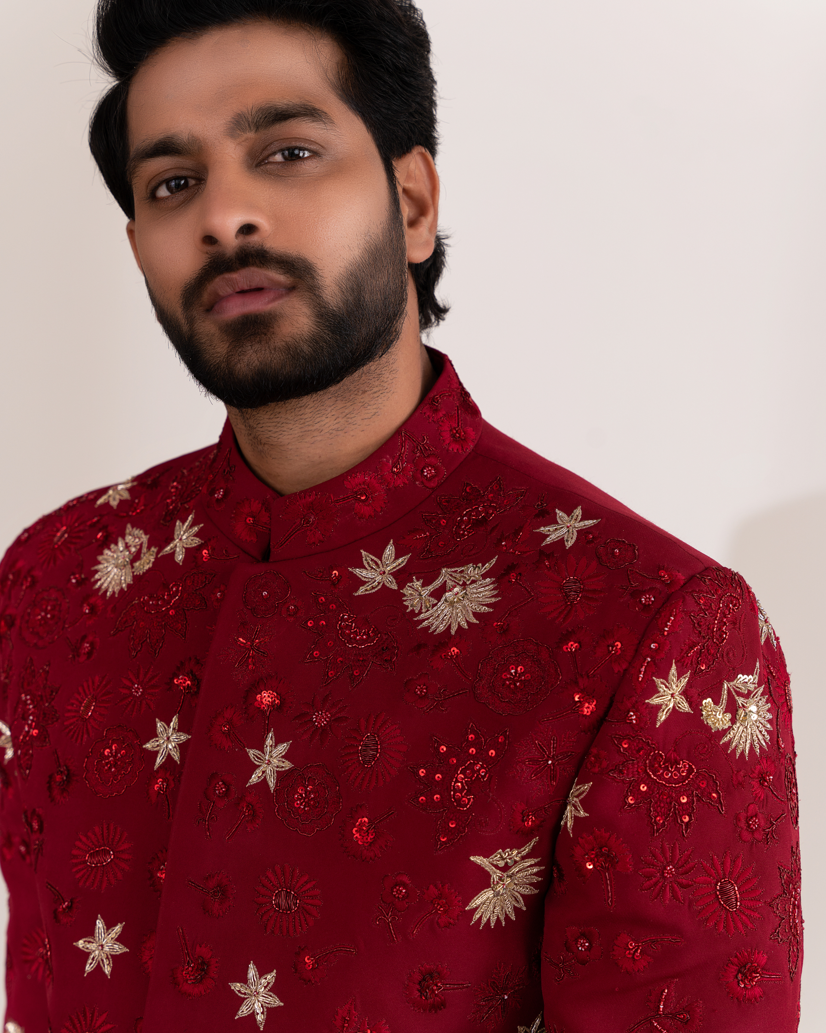 Close-up of embroidered detailing on the red bandhgala