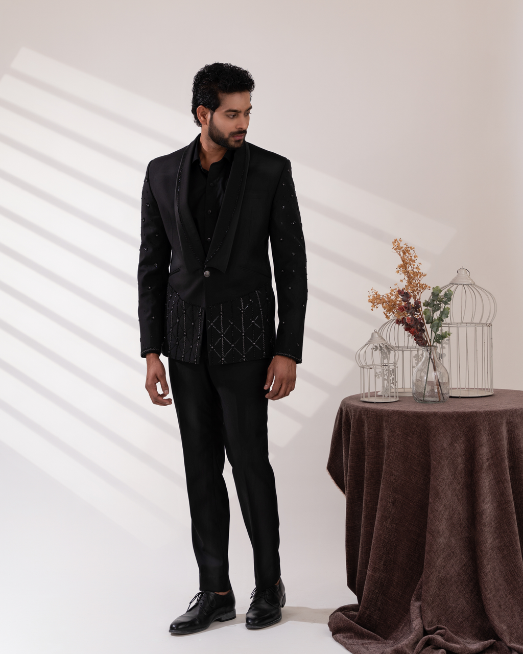 Frontal shot showing black tuxedo and pant set