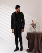 Frontal shot showing black tuxedo and pant set