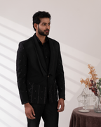 Side profile showing black tuxedo and embroidery