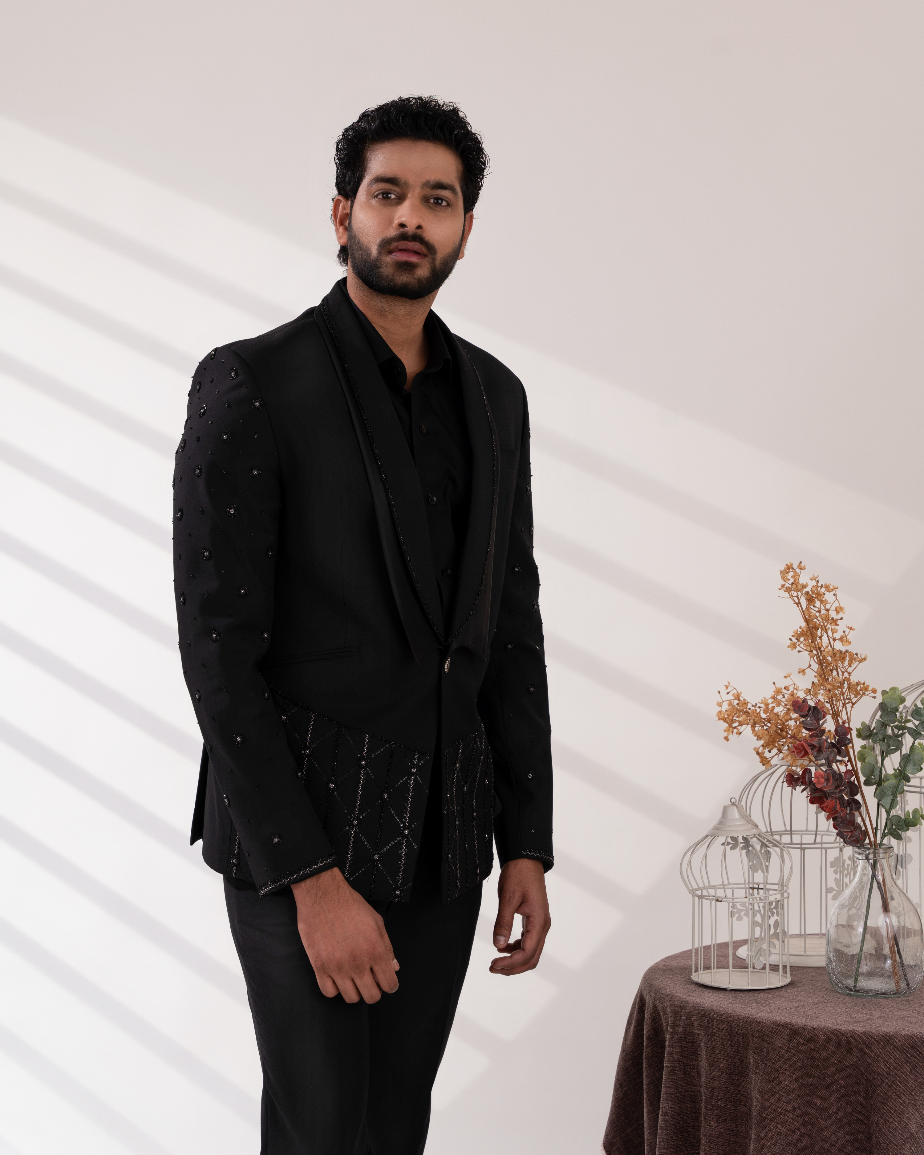 Front angle capturing the black tuxedo silhouette and pant set
