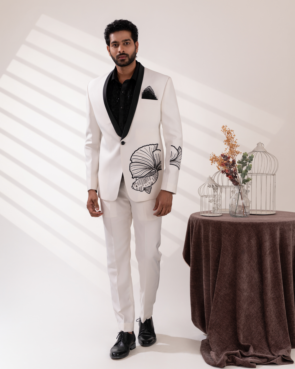 Full front view of white tuxedo with fish embroidery