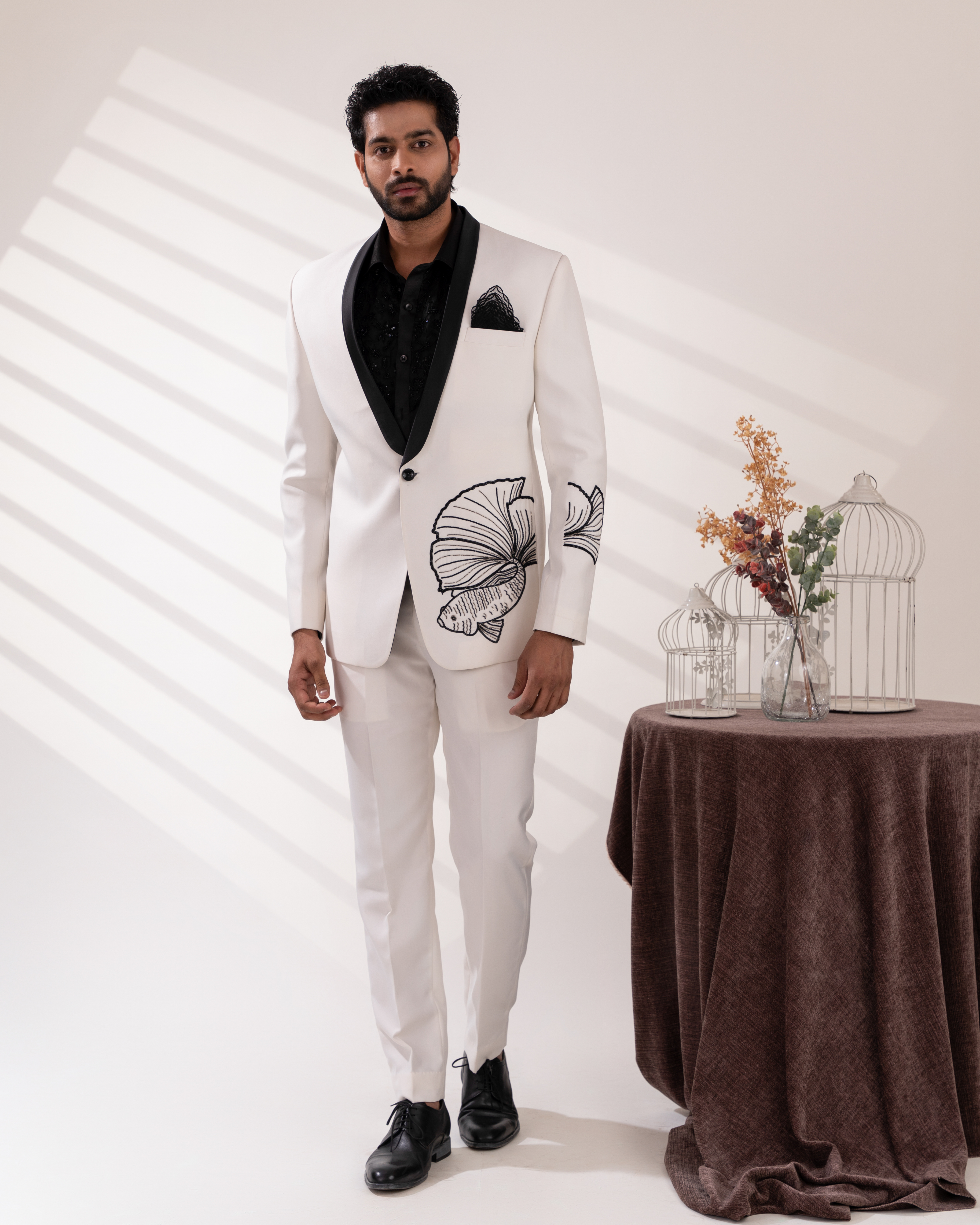 Full front view of white tuxedo with fish embroidery