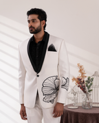 Close up shot showing fish embroidery on white tuxedo