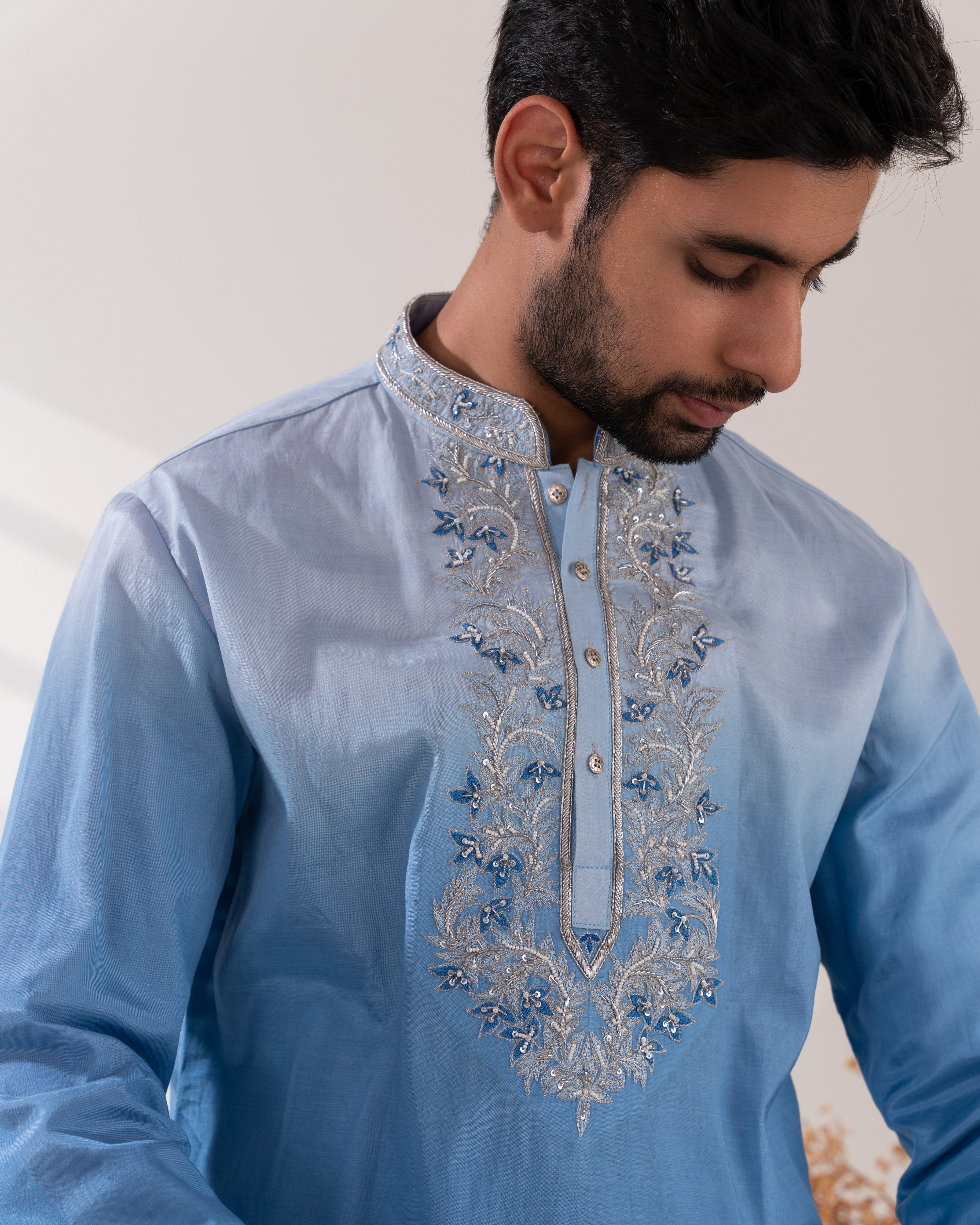Close-up of paisley embroidery on the Kurta front panel.