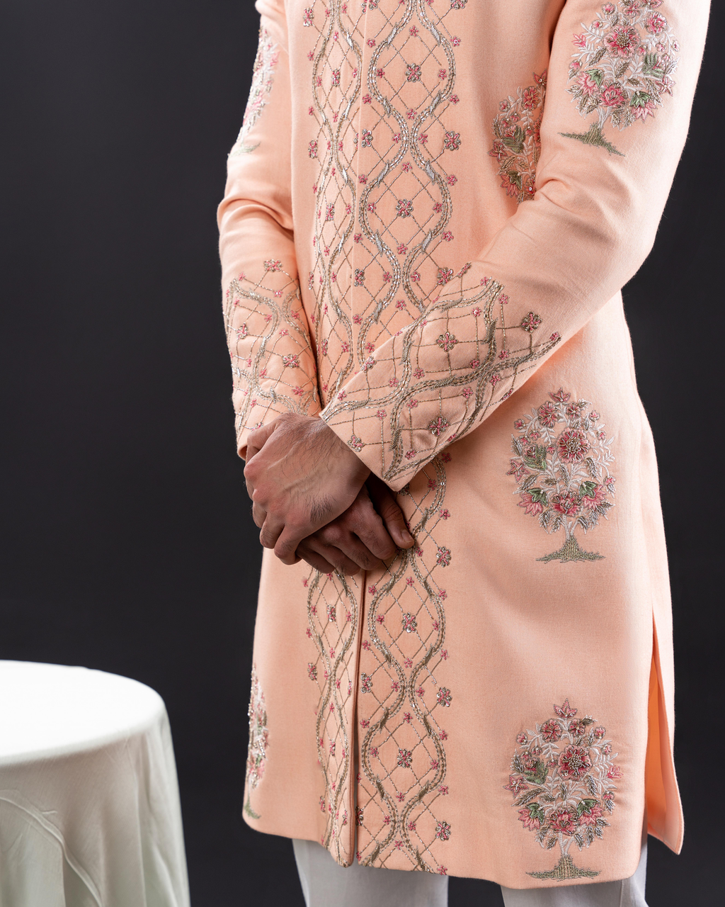 Side view showing sherwani cut and embroidery placement.