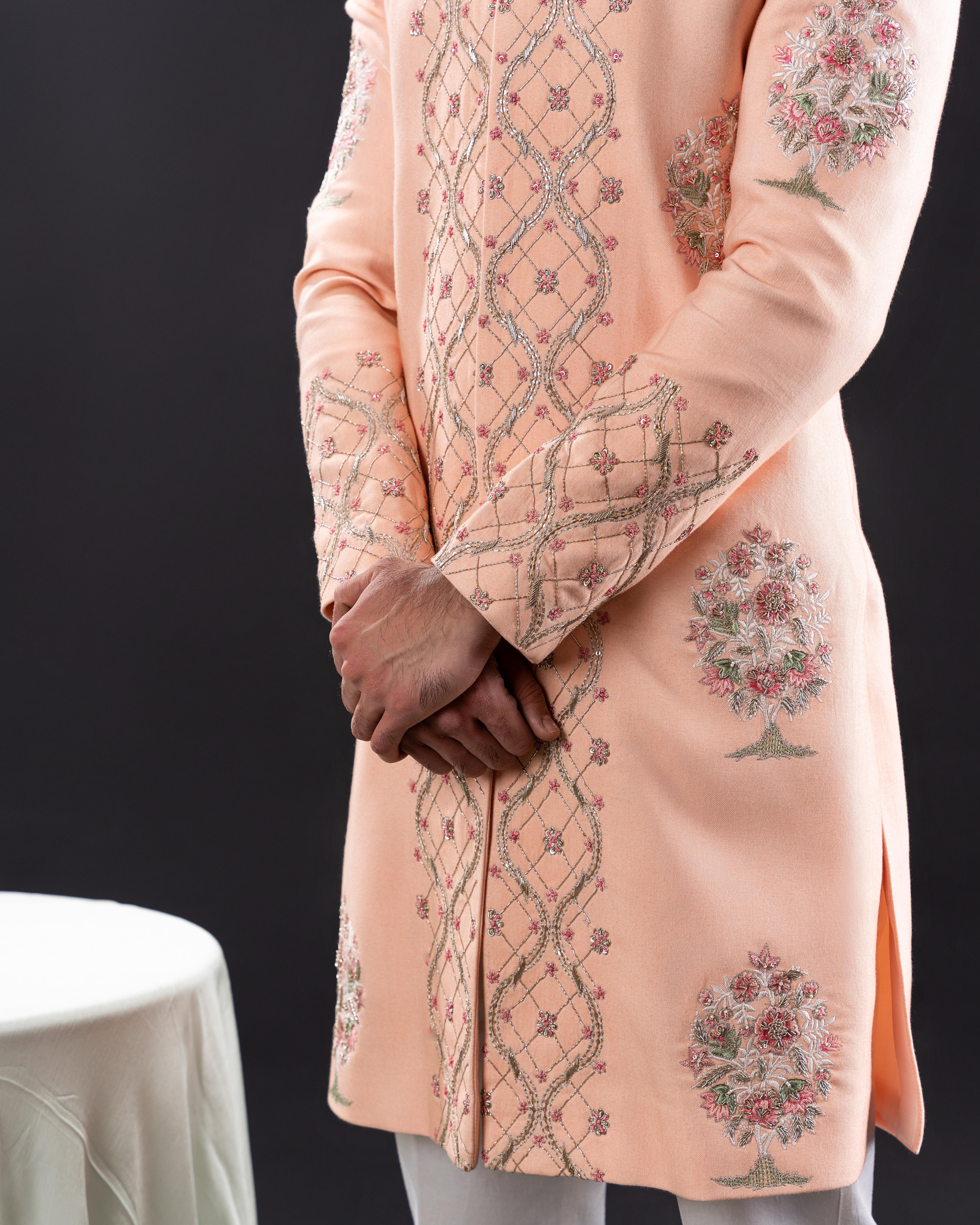 Side view showing sherwani cut and embroidery placement.