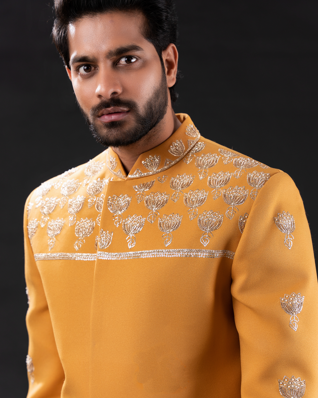 Close up shot of mustard yellow embroidered bandhgala 
