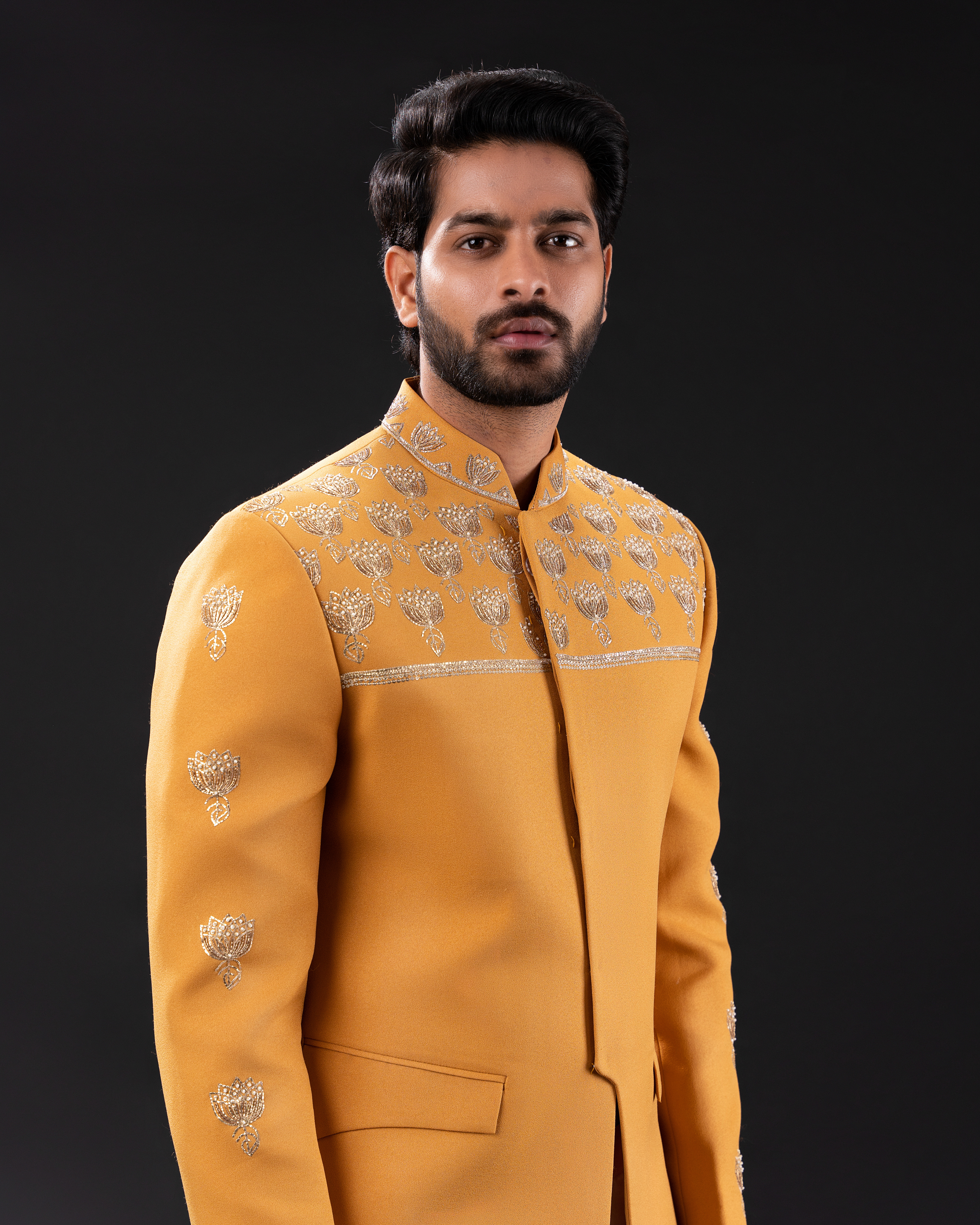 Frontal shot showcasing the warm mustard tone and clean silhouette of embroidered bandhgala