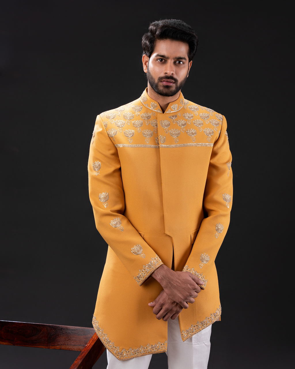 Man wearing a yellow embroidered sherwani 