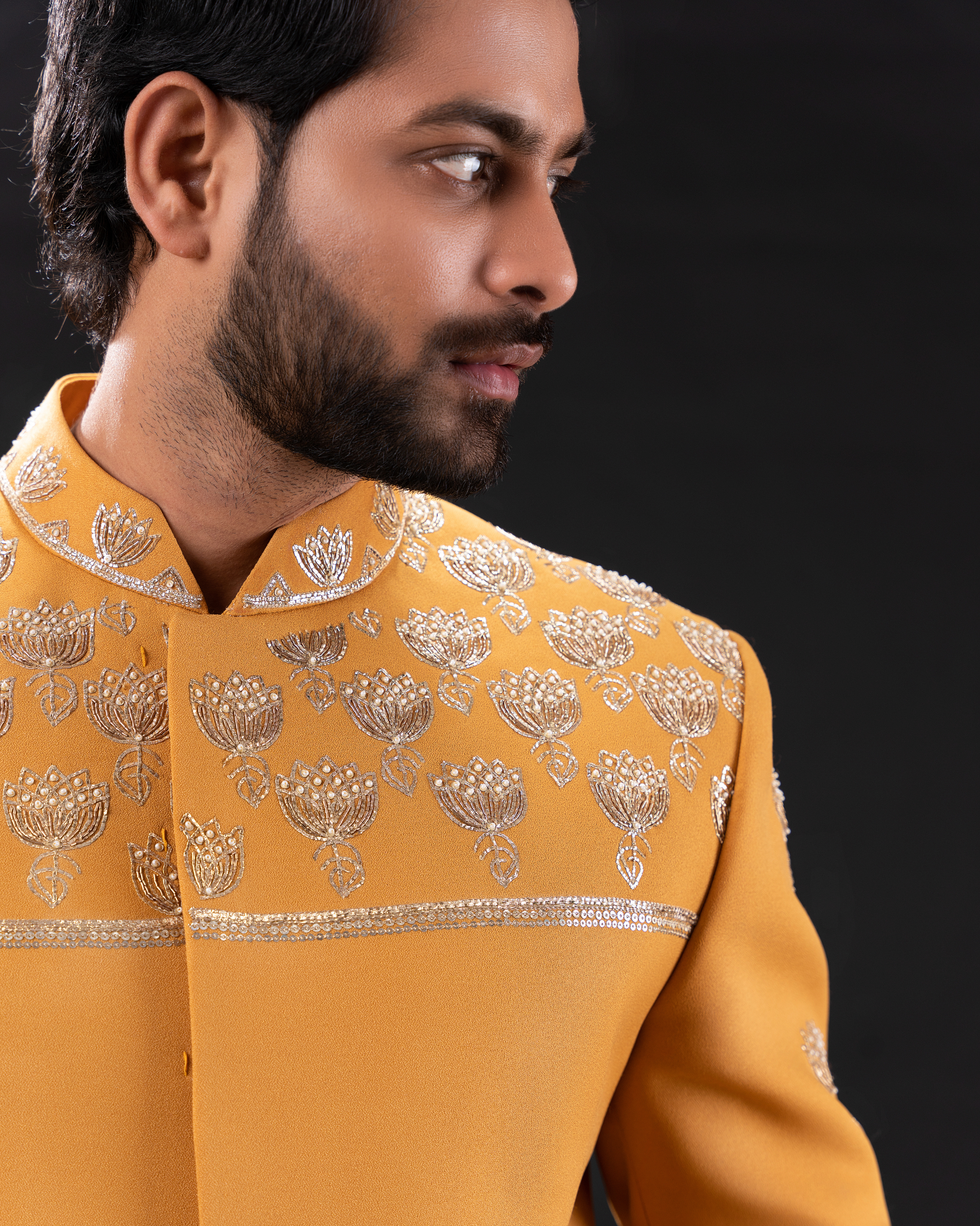 Side view showing the bandhgala shape and handwork placement.