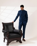 Front view of a navy pintucks bandhgala set with structured tailoring.