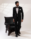 Front view of a black blazer and shirt pant set with embroidered lapel