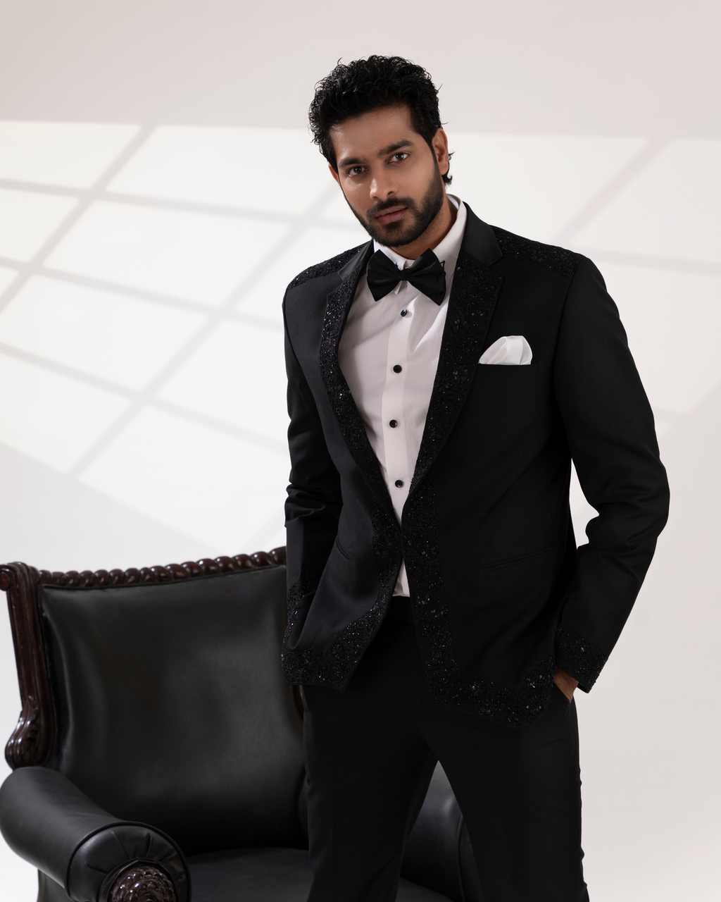 Front view showing the embroidery on black blazer and silhoutte
