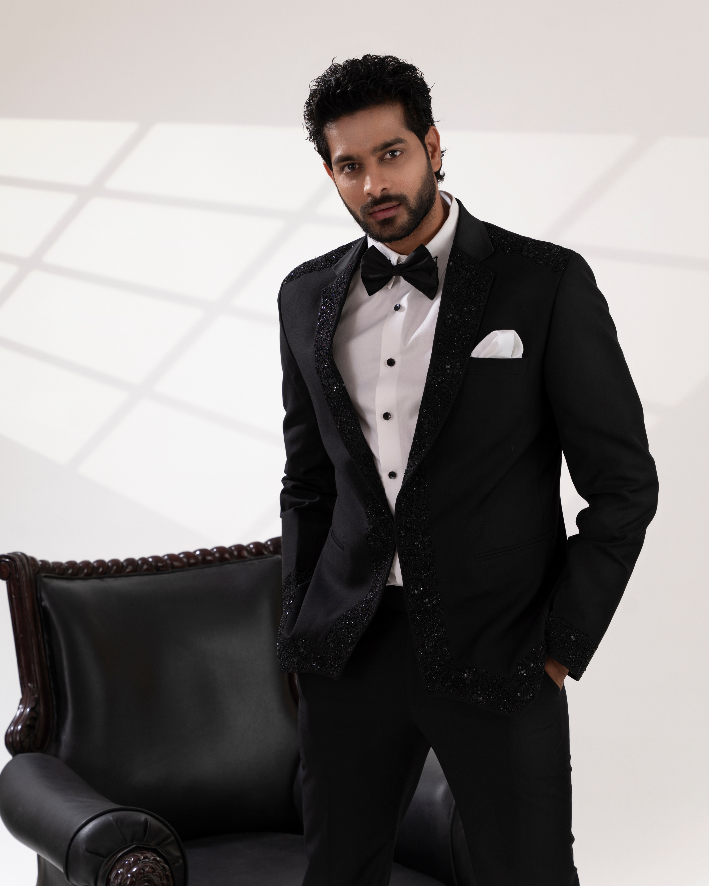 Front view showing the embroidery on black blazer and silhoutte