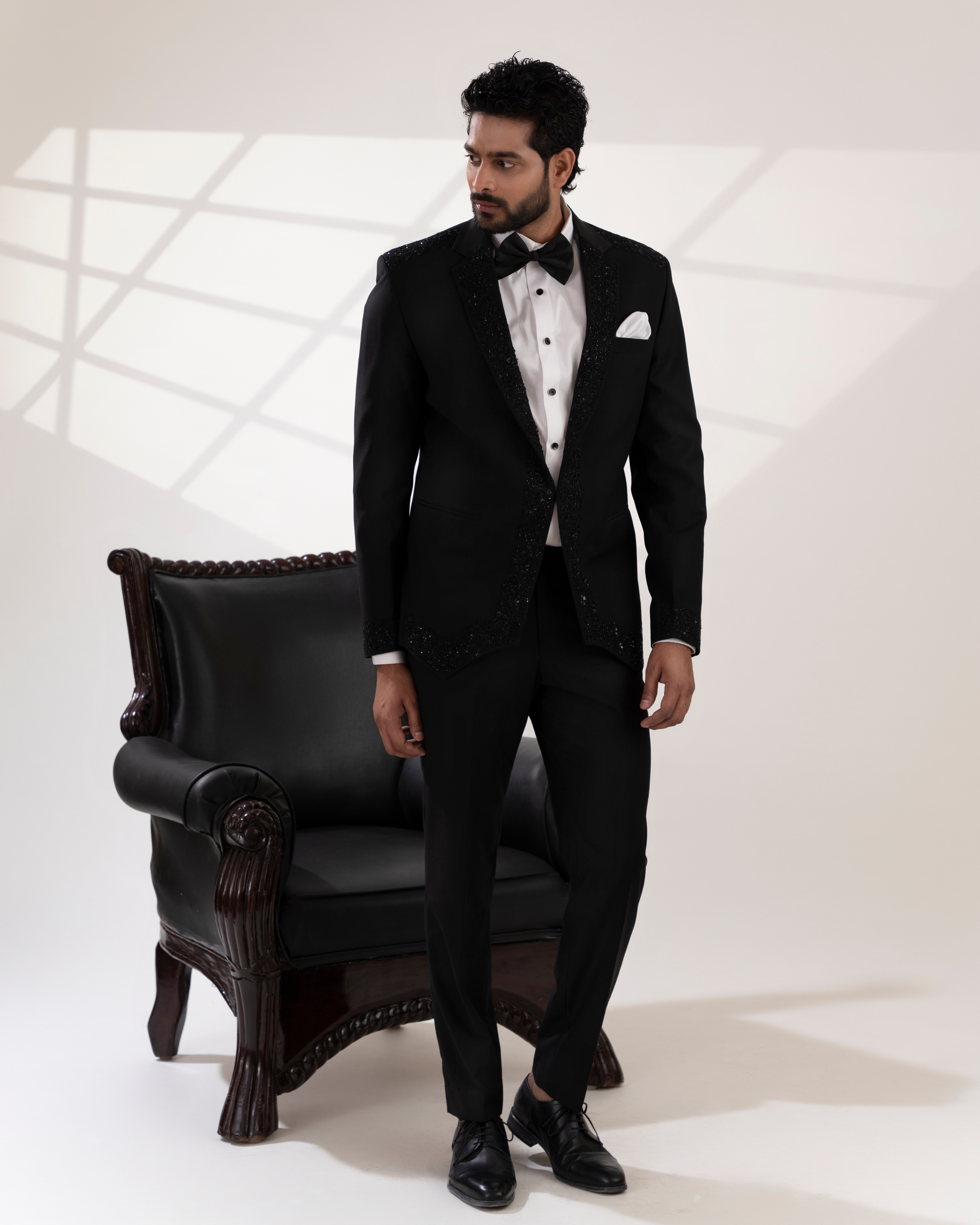 Frontal shot showcasing crisp tailoring and structured blazer with pants