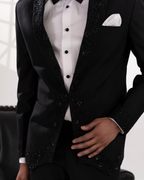Black embroidered tuxedo with white shirt and bow tie 