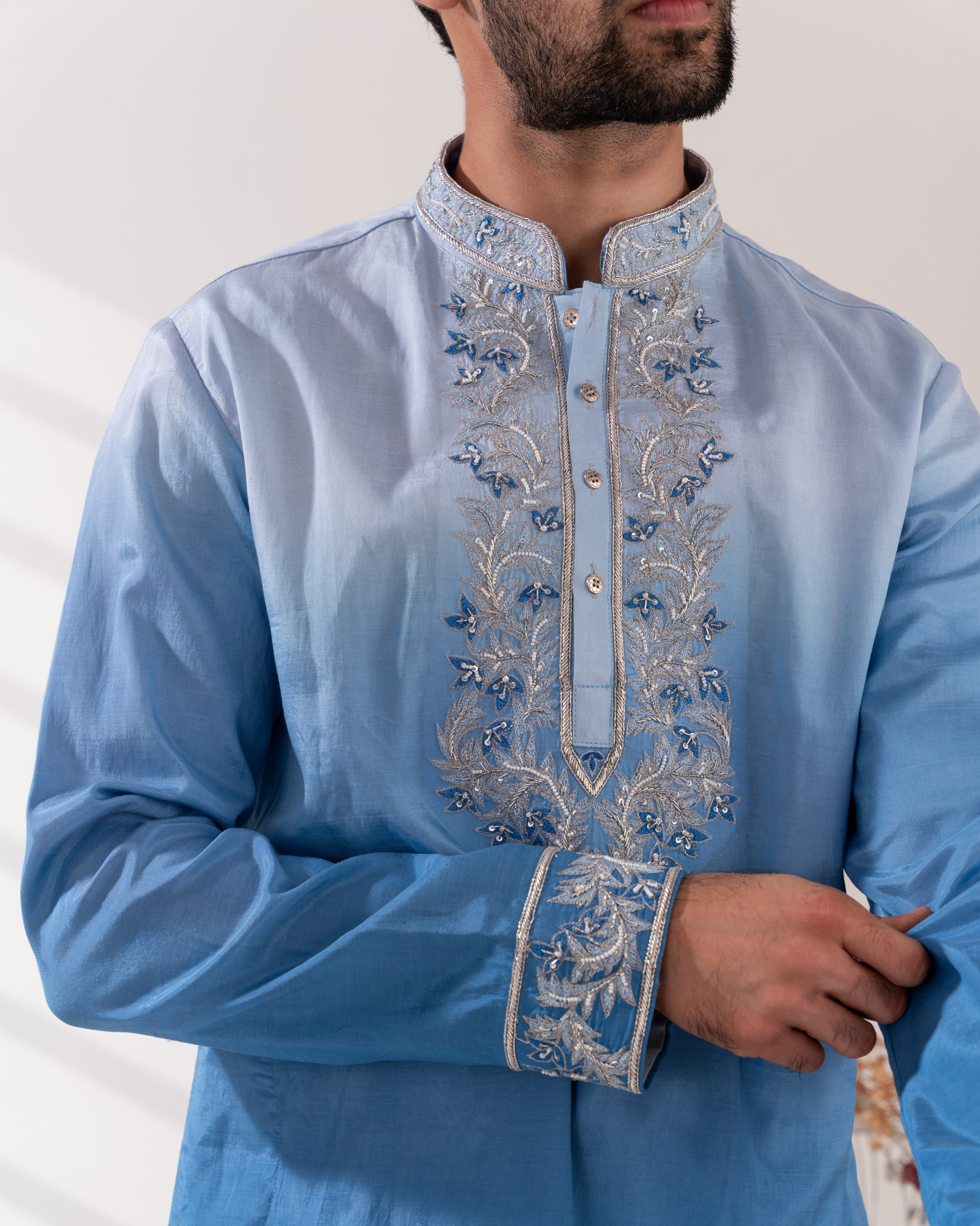 Close-up showing the ombré fabric texture and detailed threadwork.