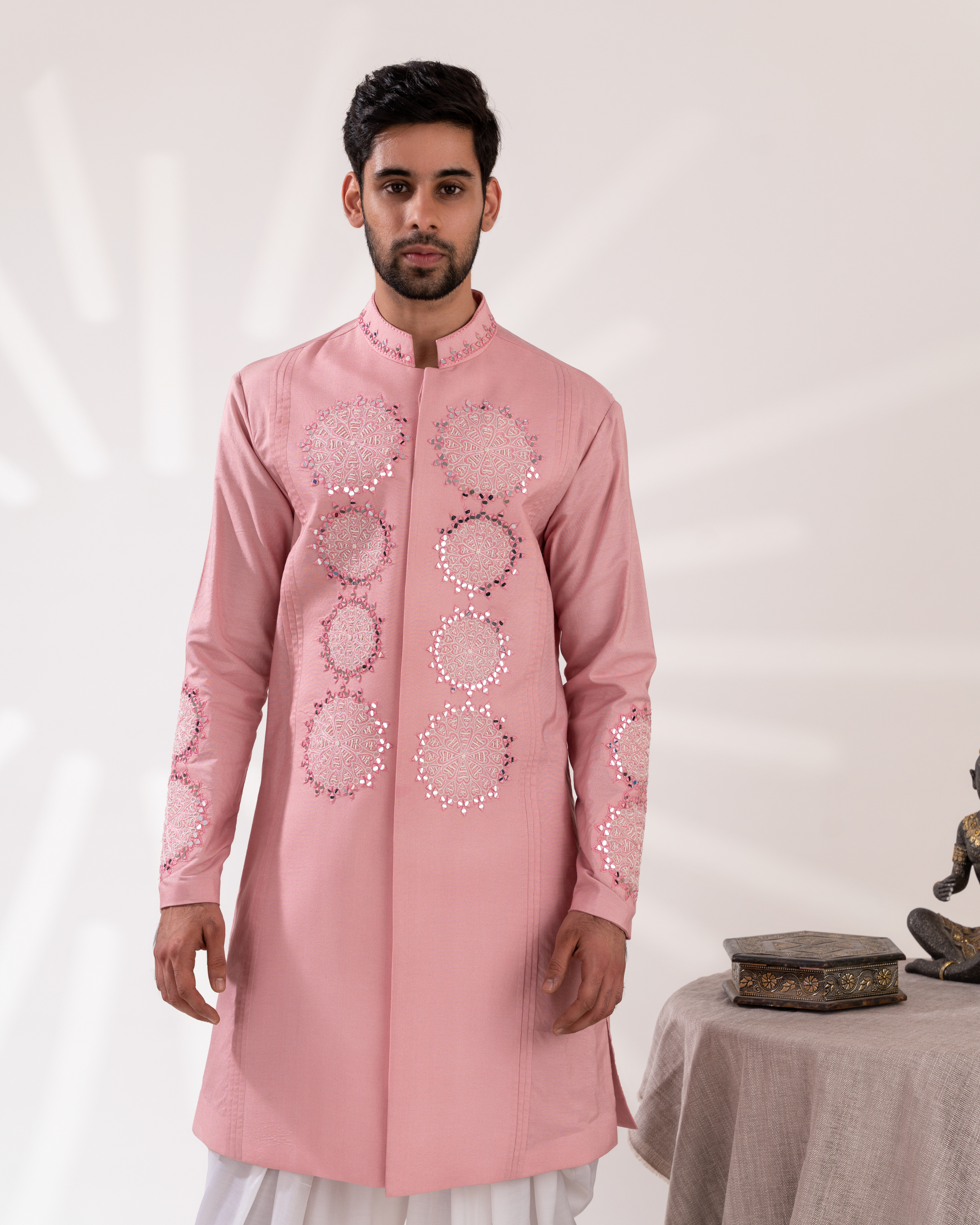 Frontal image highlighting the sherwani’s pastel tone and embroidery