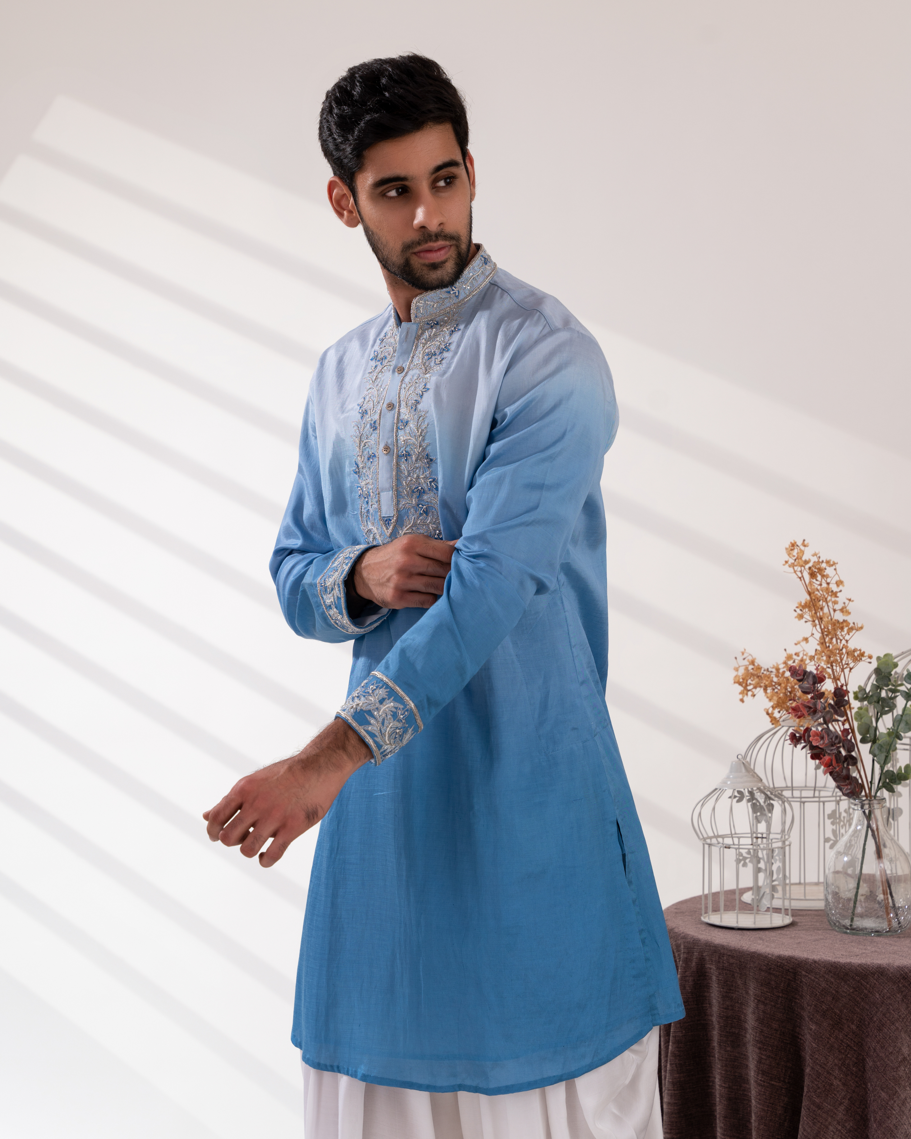 Side view showing the ombré kurta and fine embroidery.