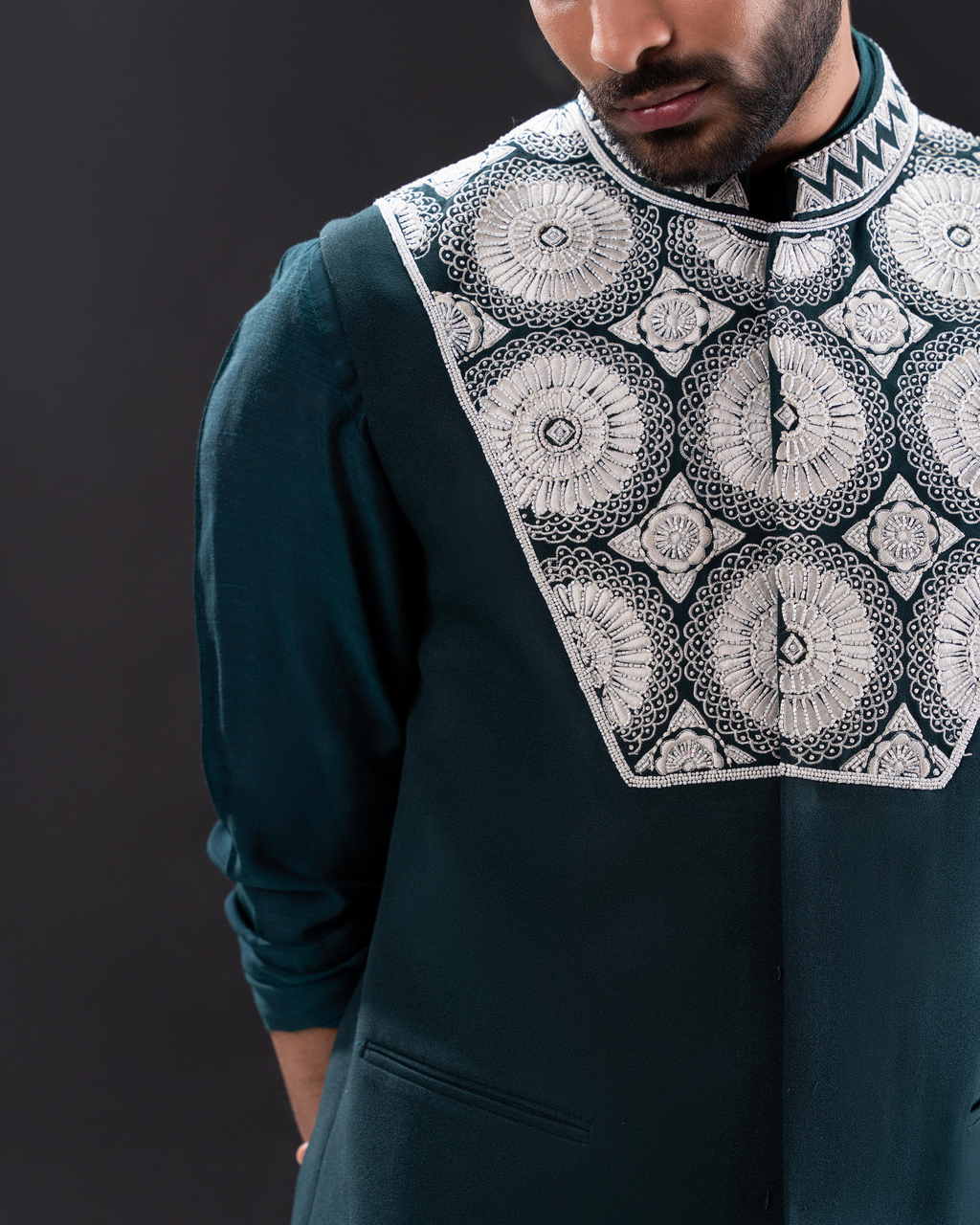 Detailed shot showing texture and embroidery on green bundi set