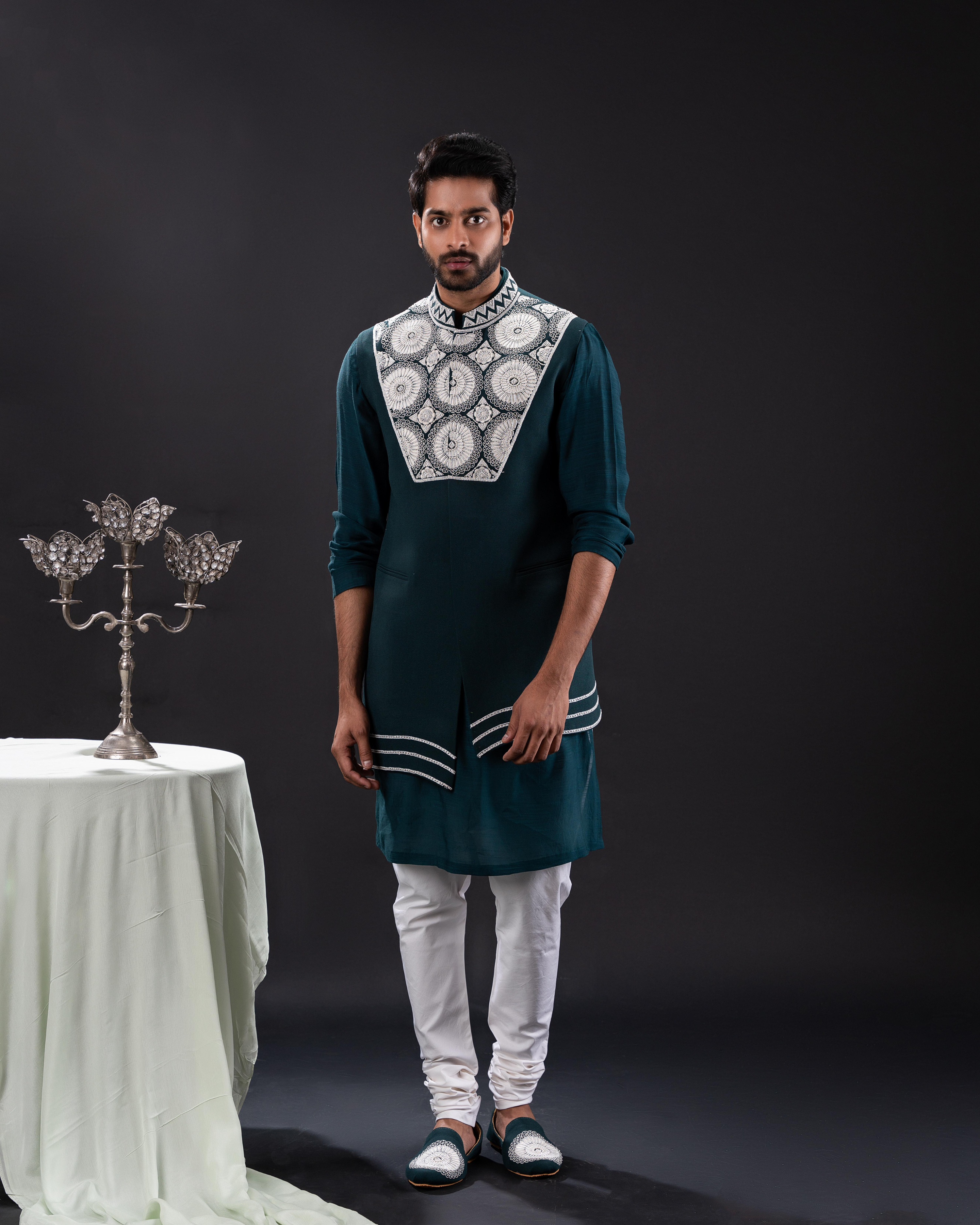Frontal shot capturing the jewel-green bundi kurta set with white pans