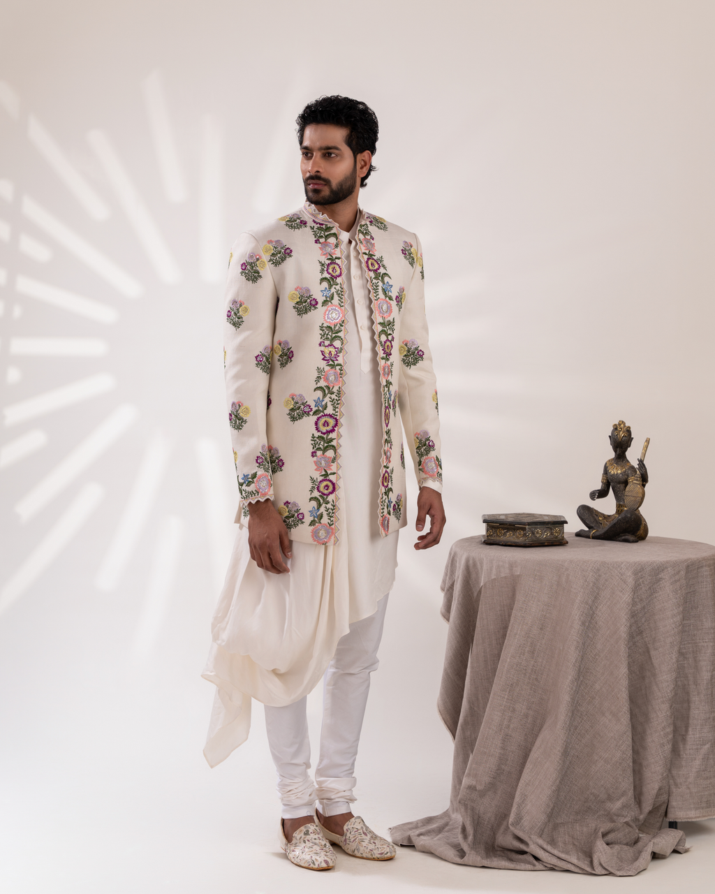 Side view showing jacket and kurta drape with white pants