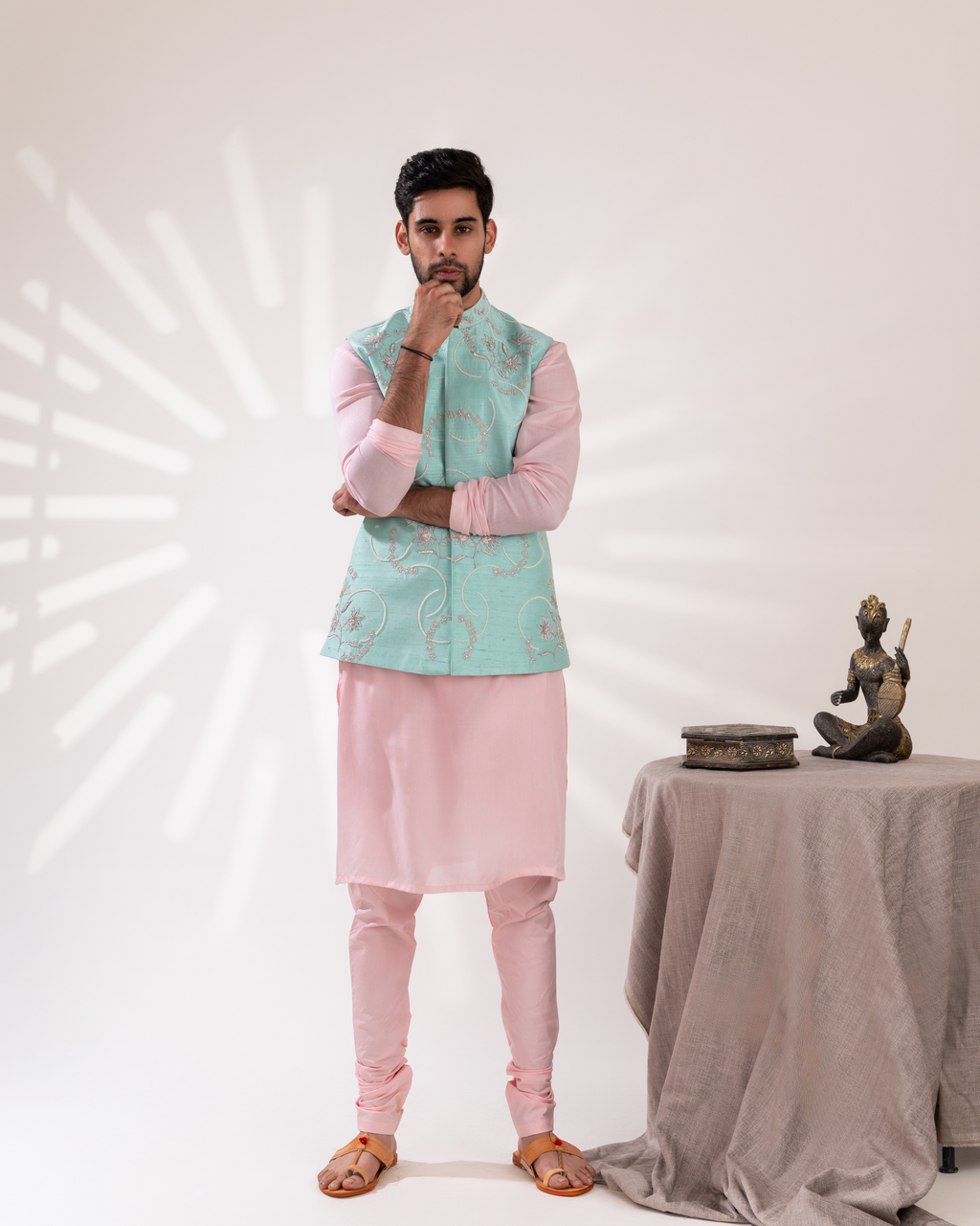 Front view of an aqua and peach Bundi set with a clean festive silhouette.