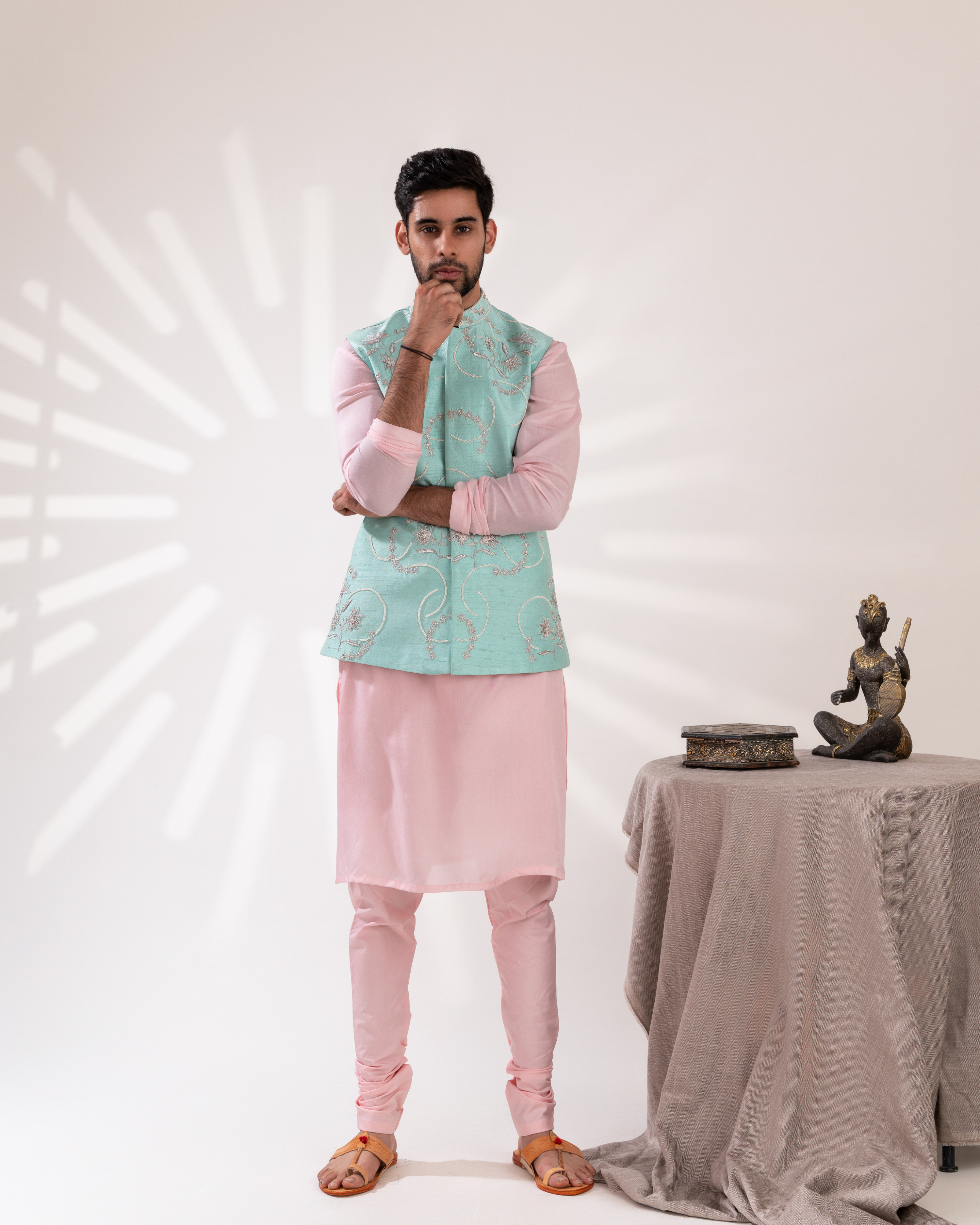 Front view of an aqua and peach Bundi set with a clean festive silhouette.