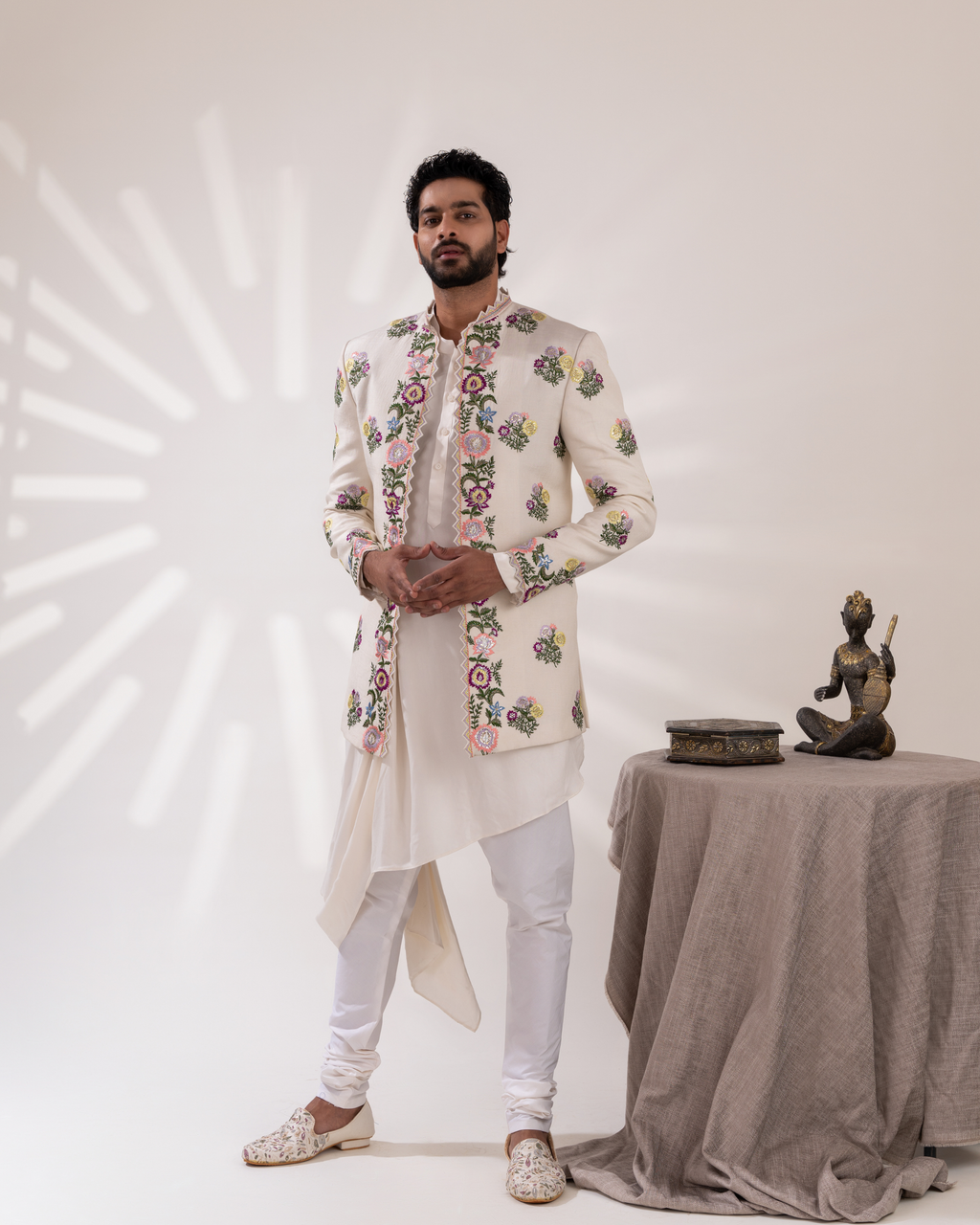 Frontal shot showing the contemporary drape and sherwani silhouette