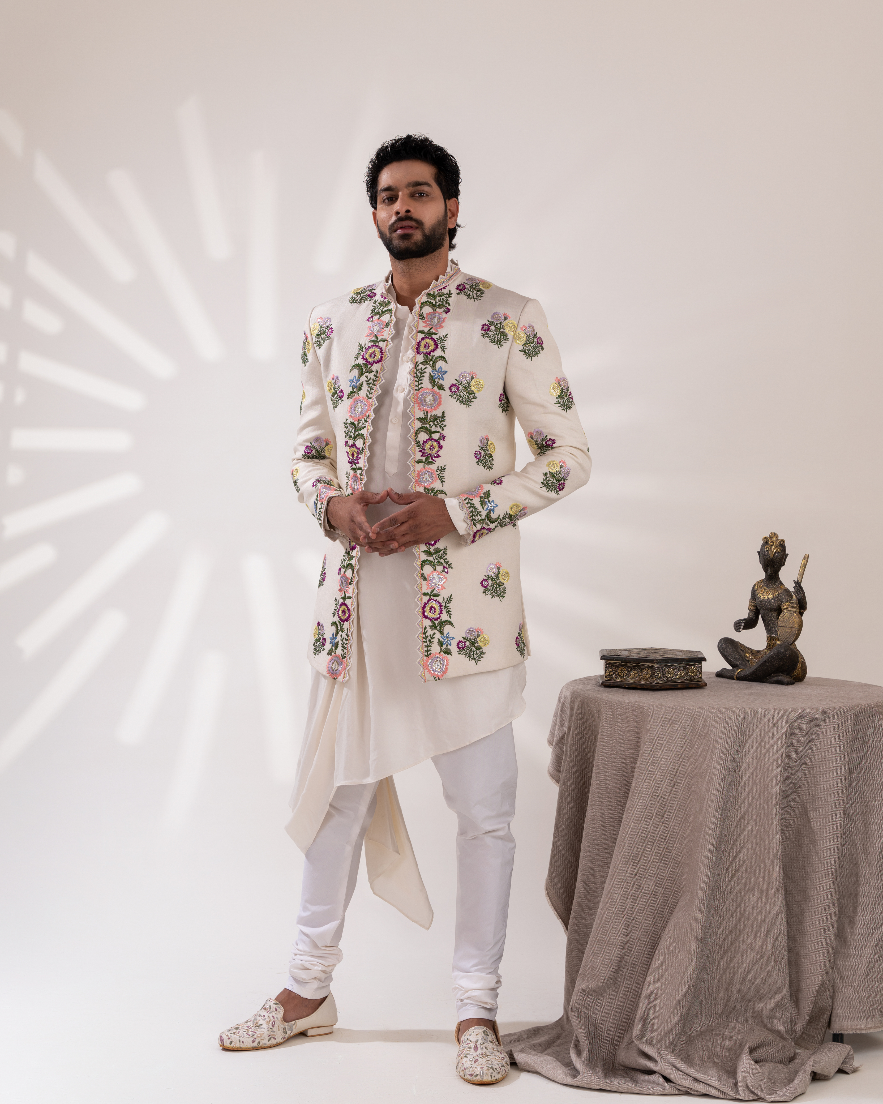 Frontal shot showing the contemporary drape and sherwani silhouette